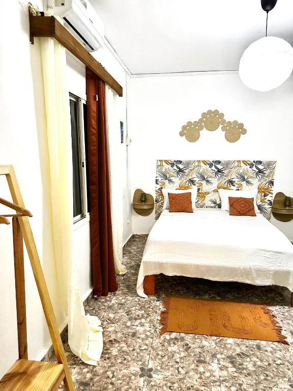 Postel nebo postele na pokoji v ubytování Chambre Djaou meublée Voidjou