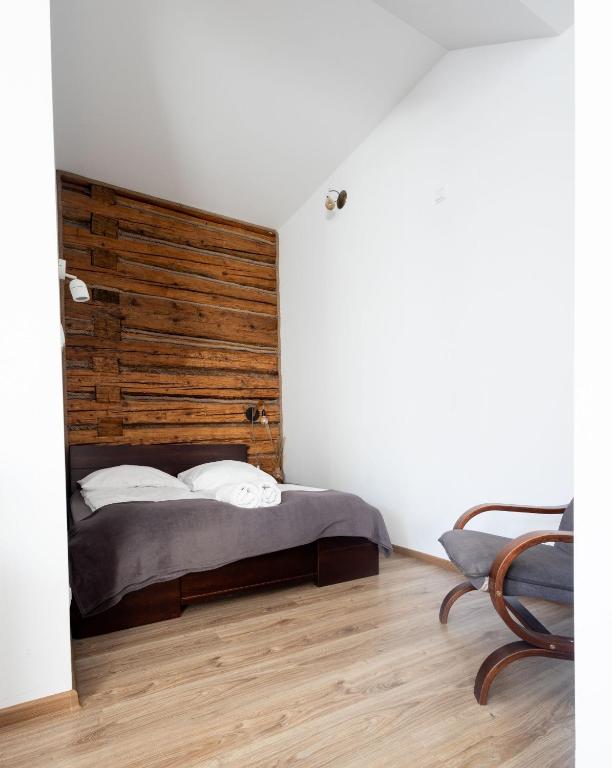 Posteľ alebo postele v izbe v ubytovaní Apartamenty pod Kicarzem