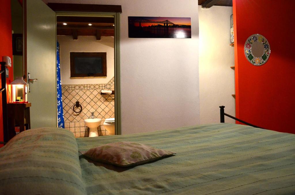 Łóżko lub łóżka w pokoju w obiekcie casa Totò
