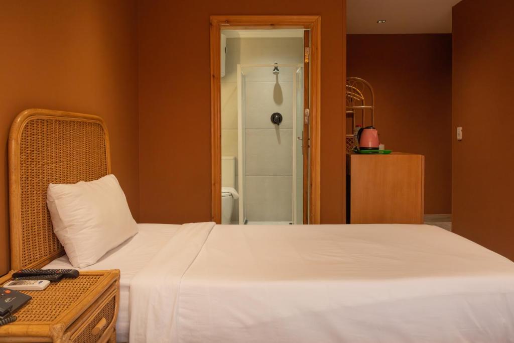 Postel nebo postele na pokoji v ubytování Jimmy Pyramids Hotel