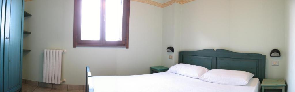 A bed or beds in a room at Residence Costamartino