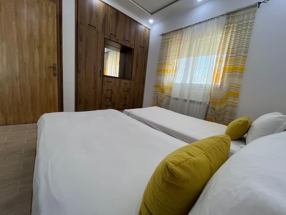 Katil atau katil-katil dalam bilik di Appartement neuf et lumineux à Nabeul