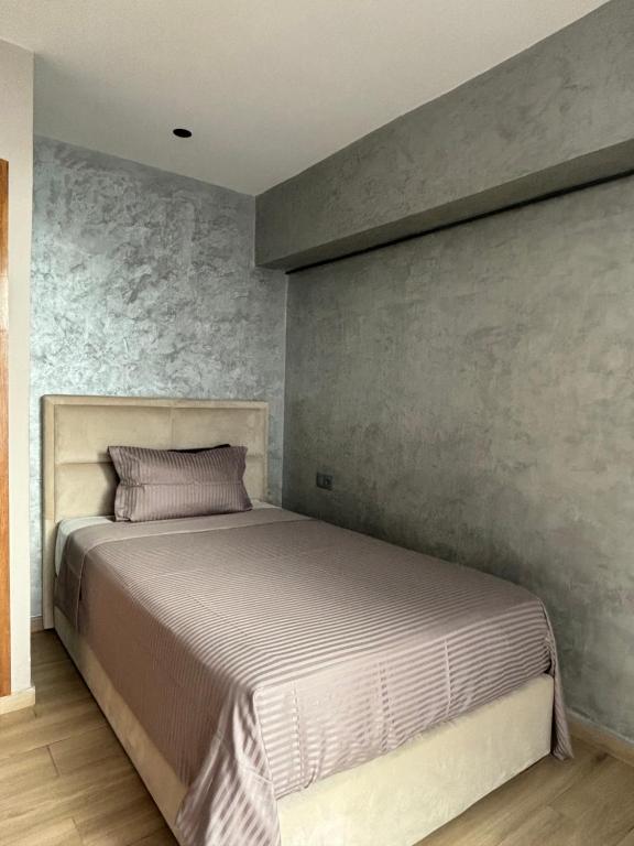 Postel nebo postele na pokoji v ubytování Appartement vue sur Tower Hassan