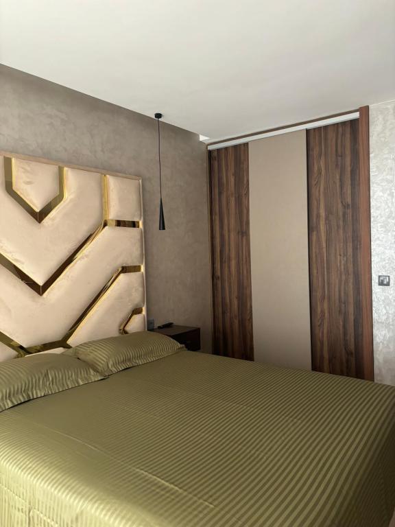 Postel nebo postele na pokoji v ubytování Appartement vue sur Tower Hassan
