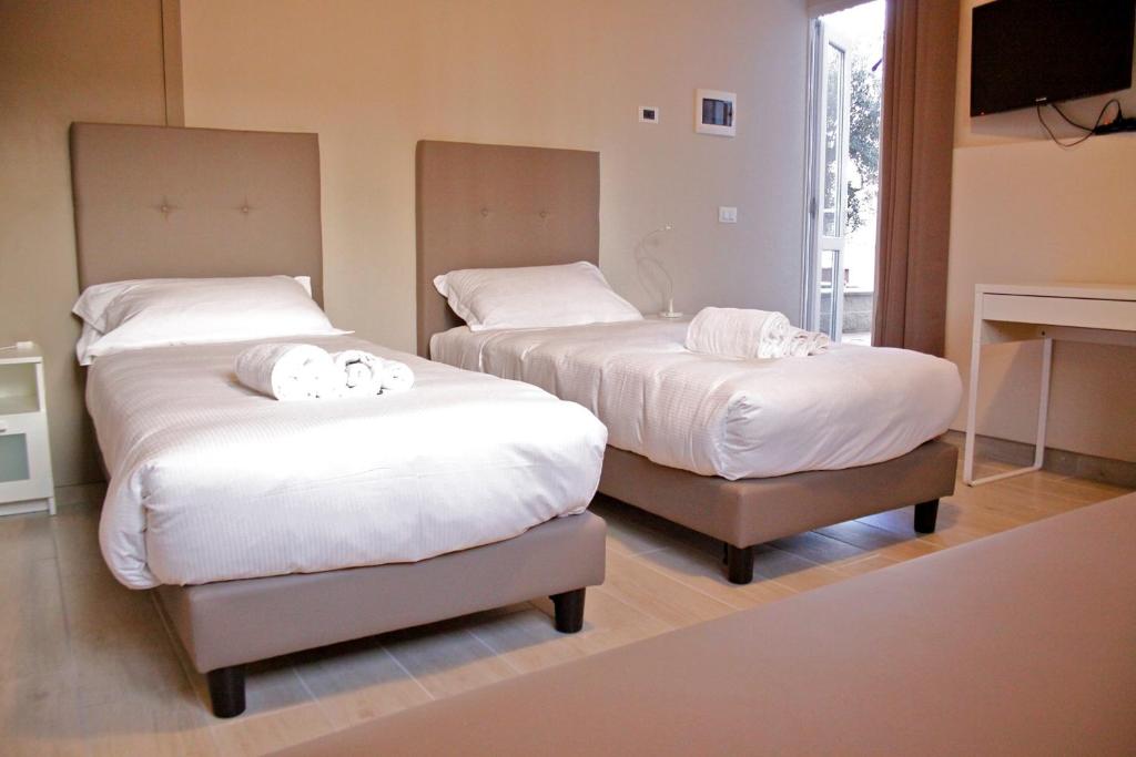 Postel nebo postele na pokoji v ubytování B&B Leonardo