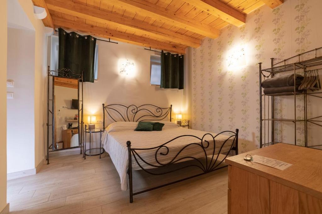 a bedroom with a metal bed in a room at Villa Ragusa Vecchia in Dubrovnik
