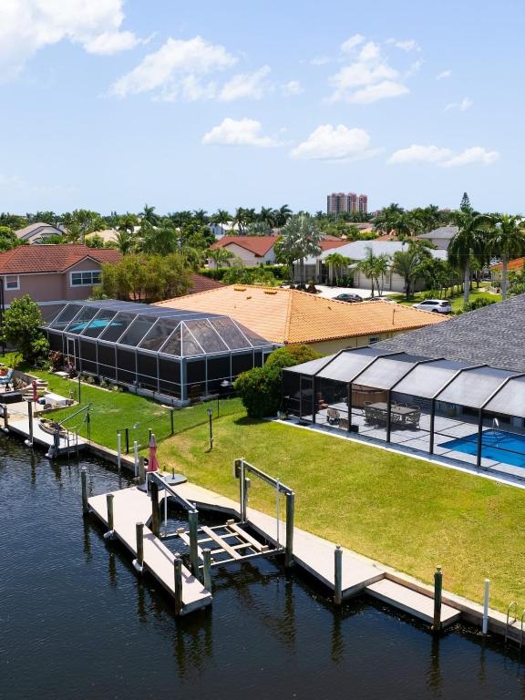 an aerial view of a building with a dock at Endless Summer Hideaway w Pool ocean access 5br in Cape Coral
