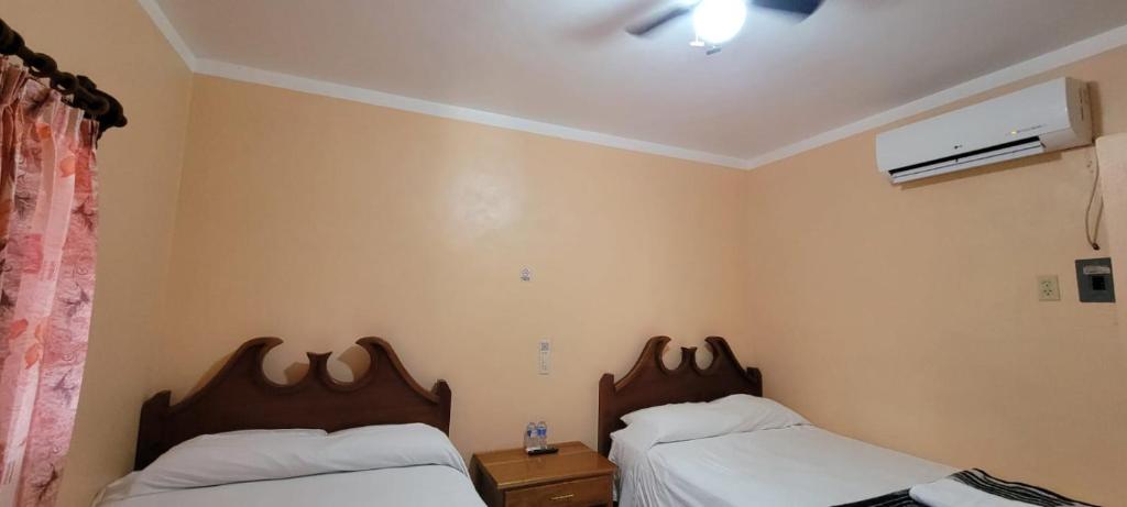 Postel nebo postele na pokoji v ubytování Hotel Calakmul