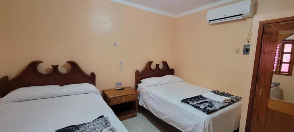 Postel nebo postele na pokoji v ubytování Hotel Calakmul