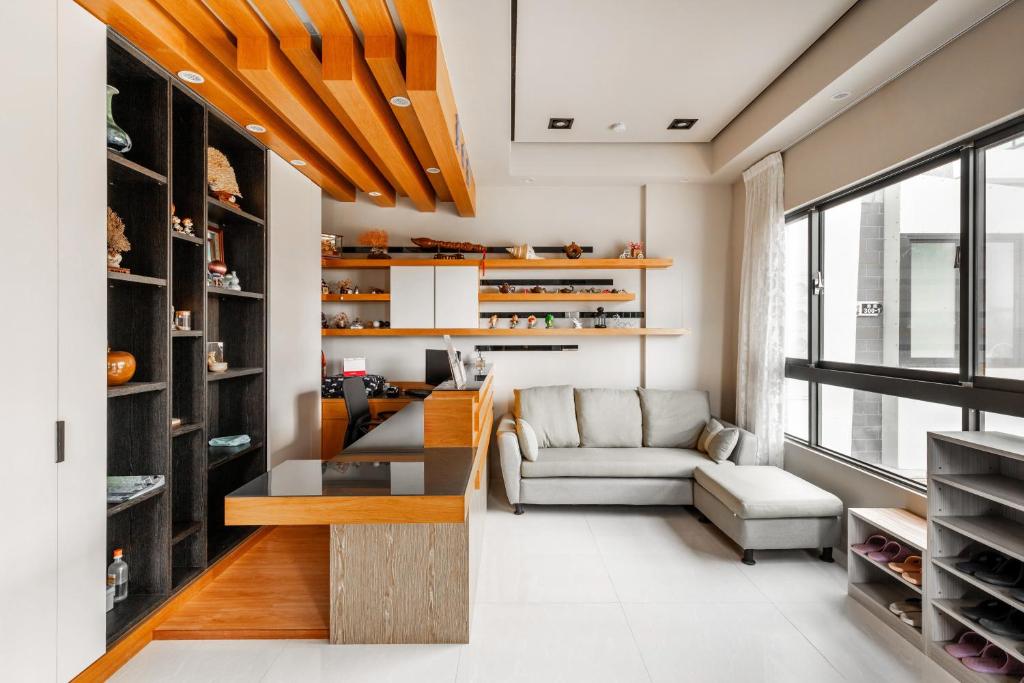 a living room with a couch and a table at Summer Crazy in Huxi