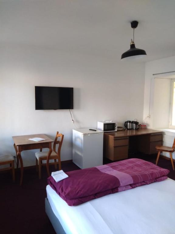 Postel nebo postele na pokoji v ubytování 1 Zimmer Studio mit Kitchenette