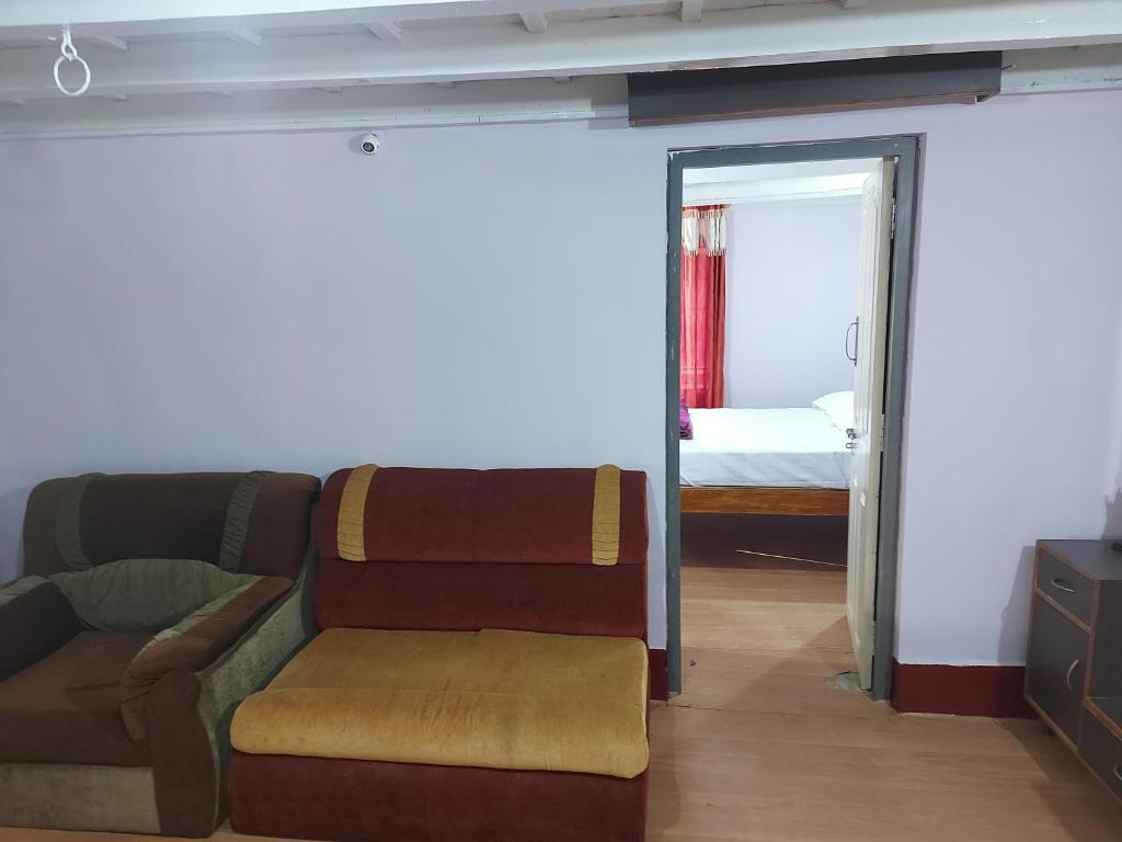 Posezení v ubytování Prestige Nature Homestay Chikmagalur