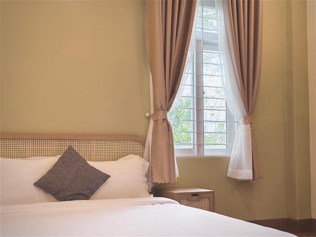 Giường trong phòng chung tại Gia An Hung Guest House