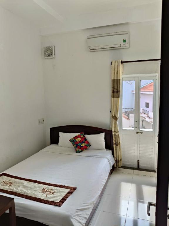 Postel nebo postele na pokoji v ubytování Hoian Old Town Hostel