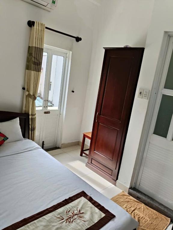 Postel nebo postele na pokoji v ubytování Hoian Old Town Hostel