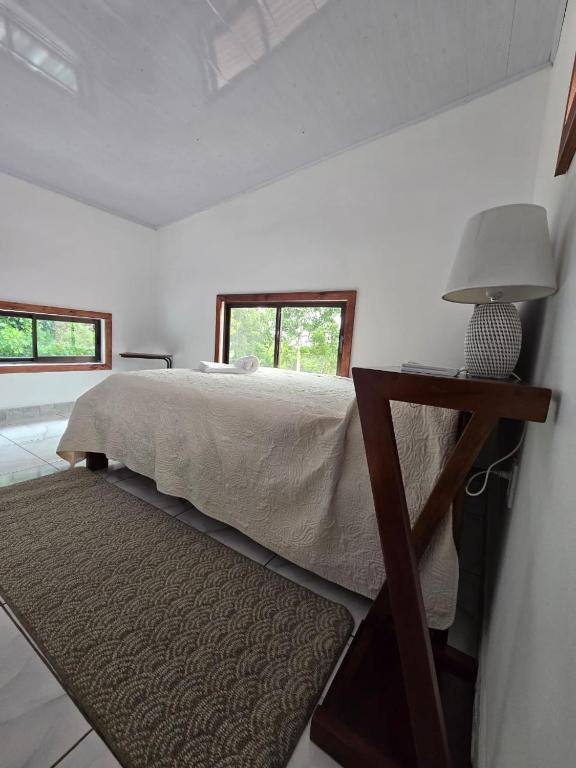 Postel nebo postele na pokoji v ubytování Happy Paradise Lodge