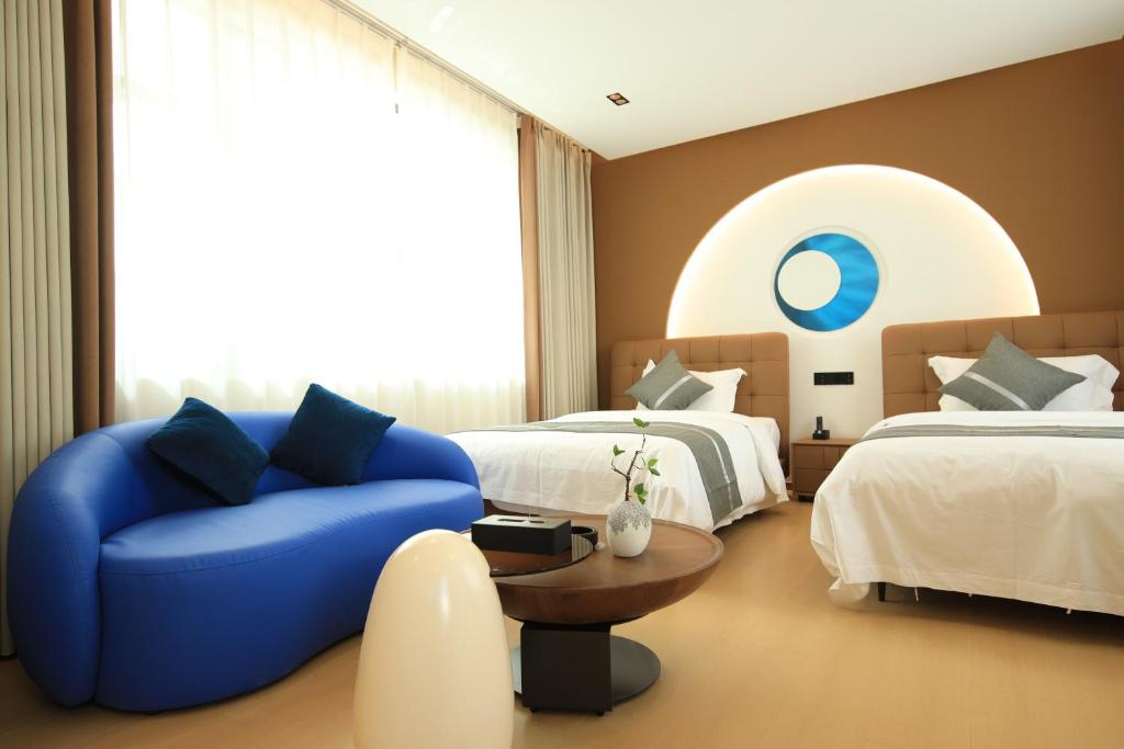 Postel nebo postele na pokoji v ubytování Dali Yufu B&B Hotel