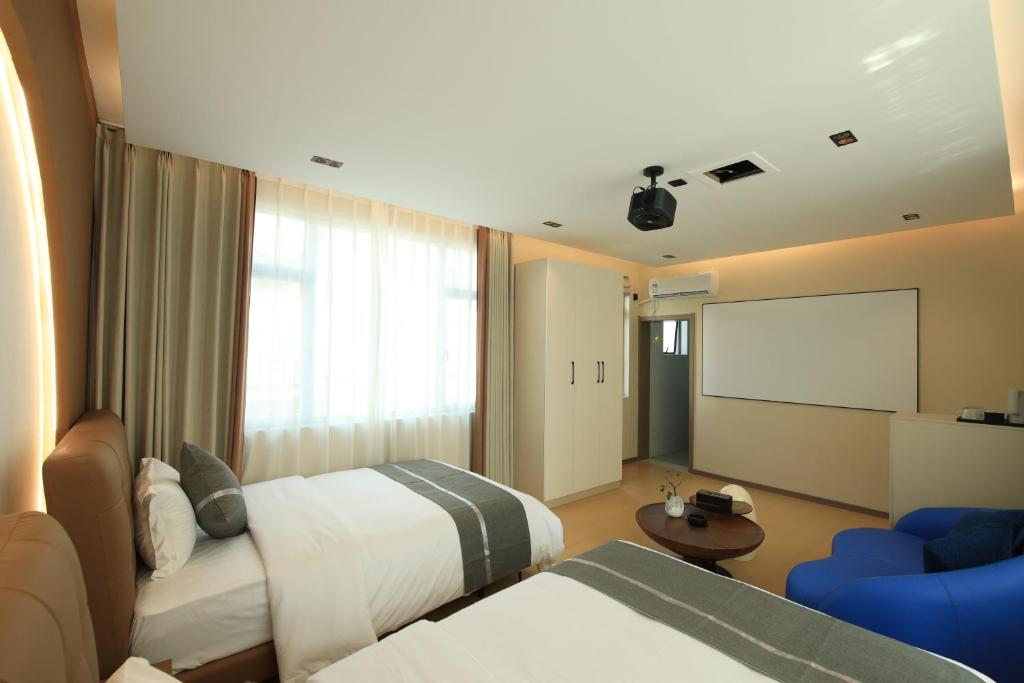 Postel nebo postele na pokoji v ubytování Dali Yufu B&B Hotel