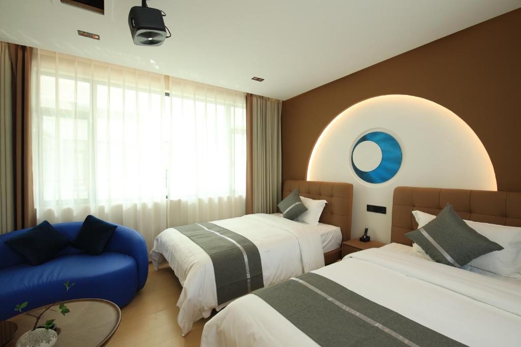 Postel nebo postele na pokoji v ubytování Dali Yufu B&B Hotel