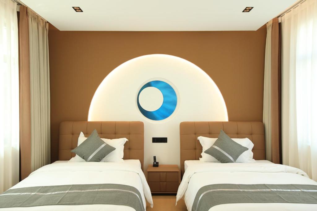 Postel nebo postele na pokoji v ubytování Dali Yufu B&B Hotel