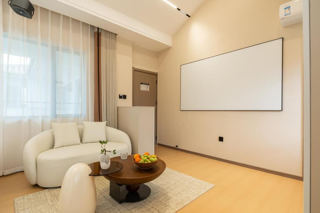 TV a/nebo společenská místnost v ubytování Dali Yufu B&B Hotel