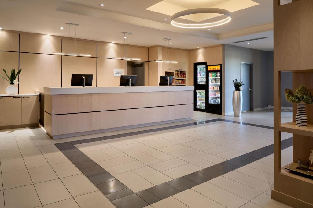 a lobby with a reception desk in a hospital at Fairfield Inn & Suites by Marriott Montreal Airport in Dorval