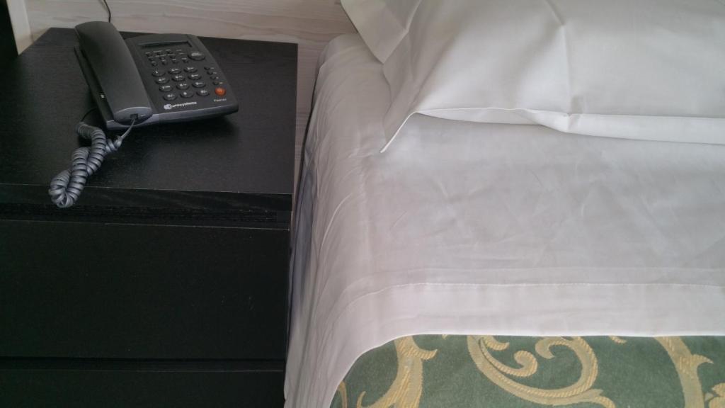 Postel nebo postele na pokoji v ubytování Hotel Canasta