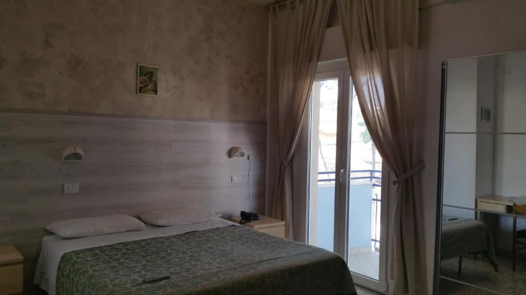 Postel nebo postele na pokoji v ubytování Hotel Canasta
