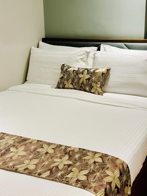 Postel nebo postele na pokoji v ubytování Buenaventura Suites