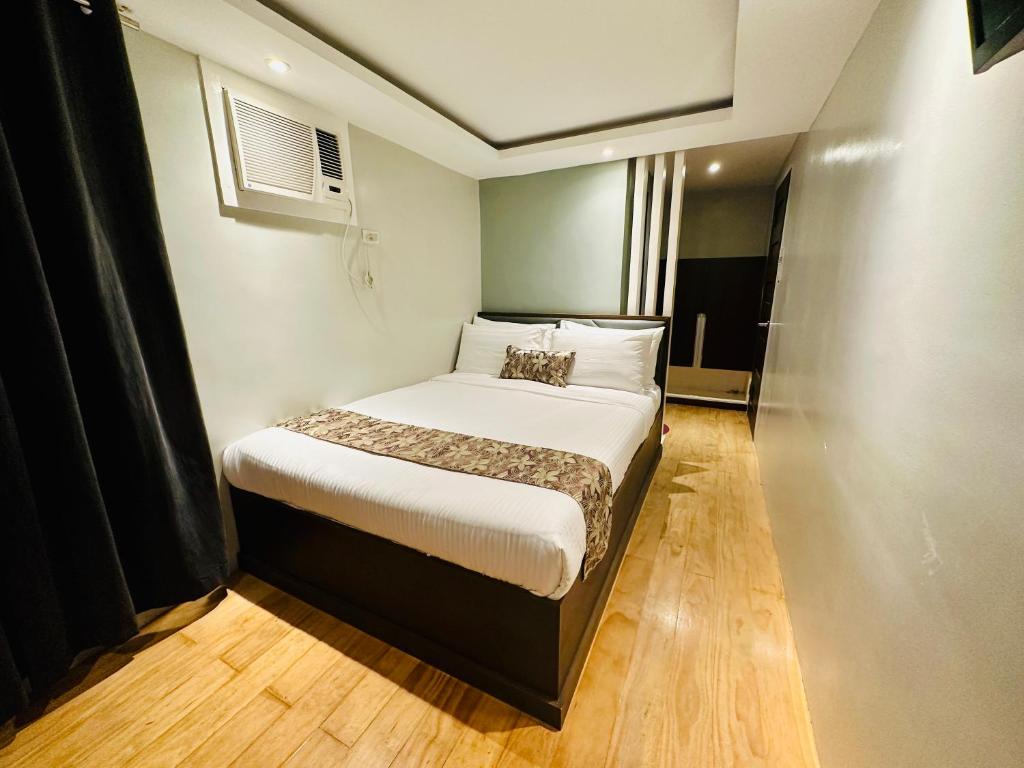 Postel nebo postele na pokoji v ubytování Buenaventura Suites