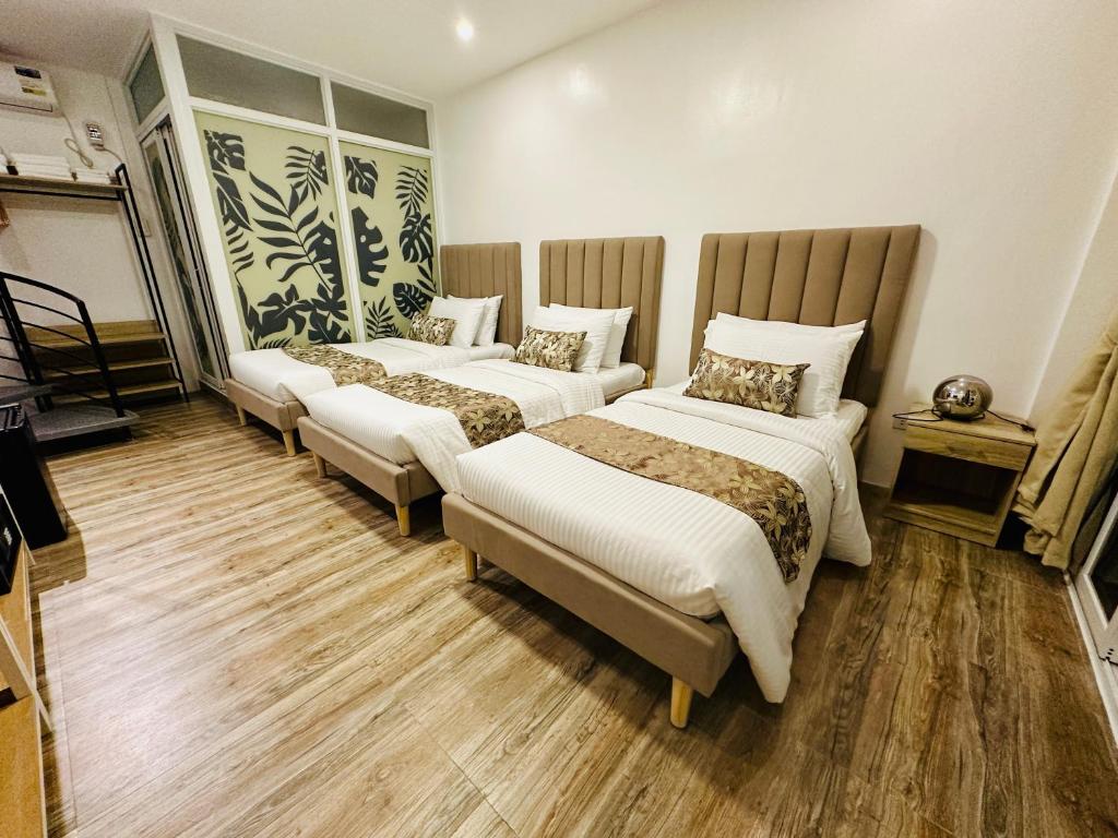 Postel nebo postele na pokoji v ubytování Buenaventura Suites