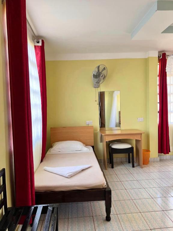 Postel nebo postele na pokoji v ubytování Desa Homes