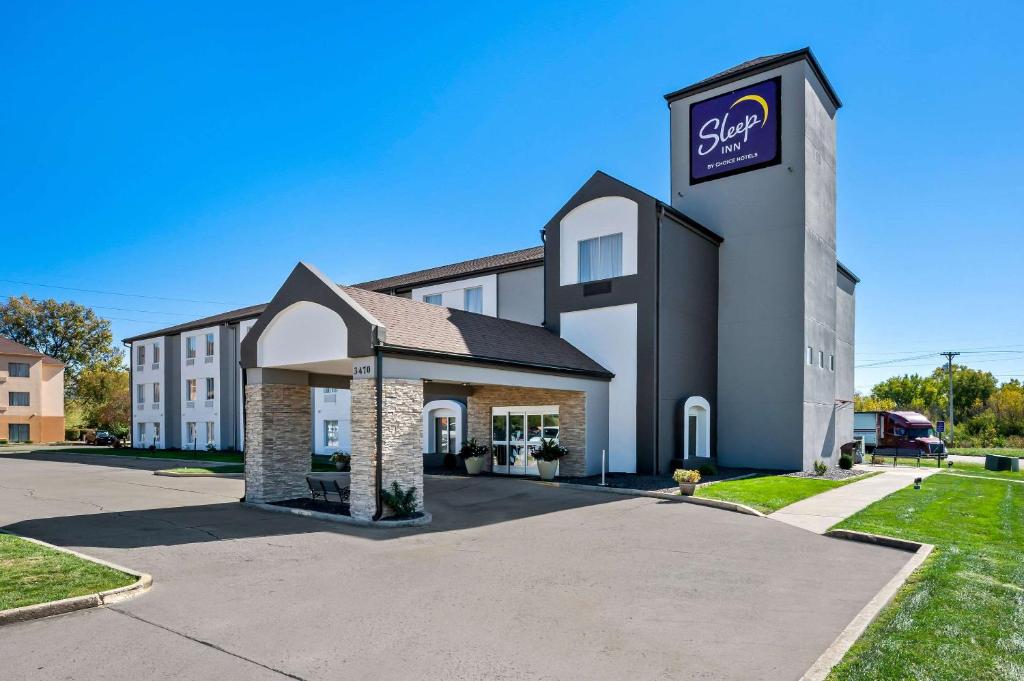 a building with a sign on the side of it at Sleep Inn Springfield West in Springfield