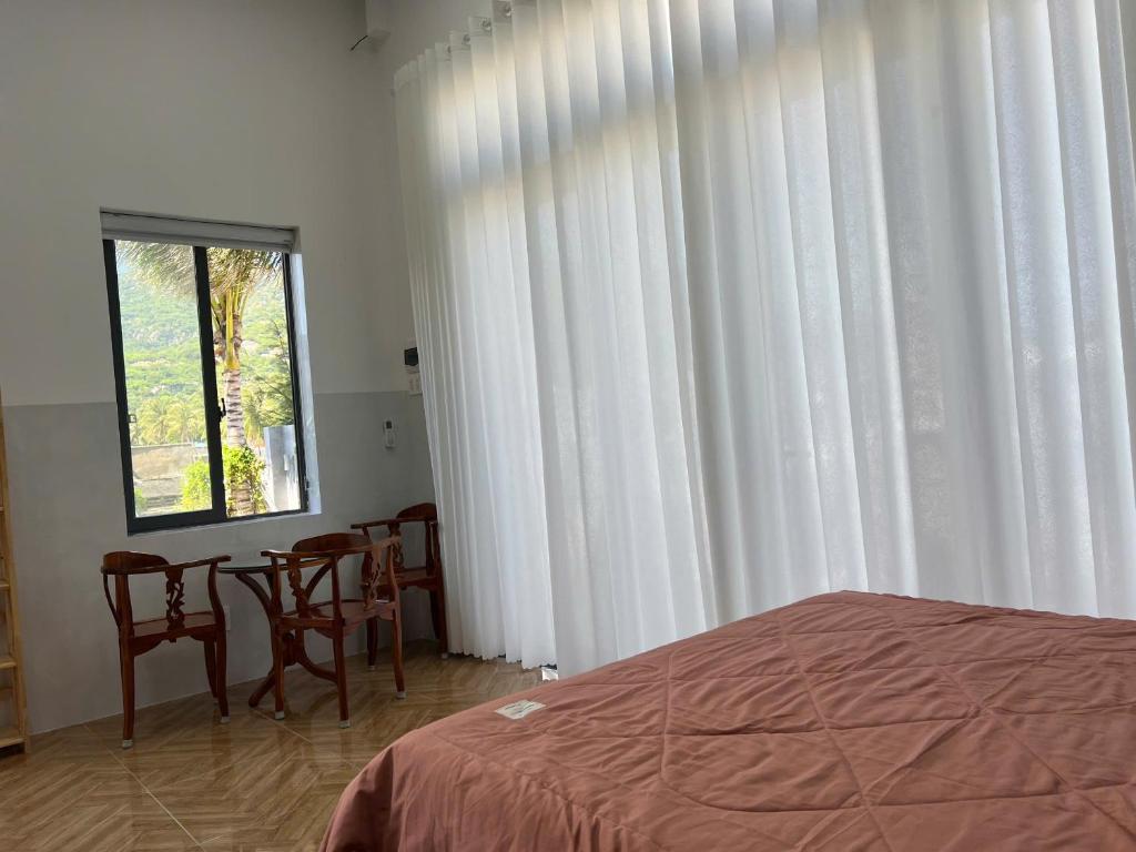Postel nebo postele na pokoji v ubytování Thái An House