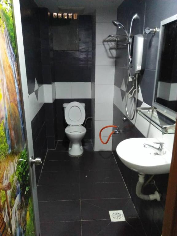 Koupelna v ubytování SV Andalas Hotel