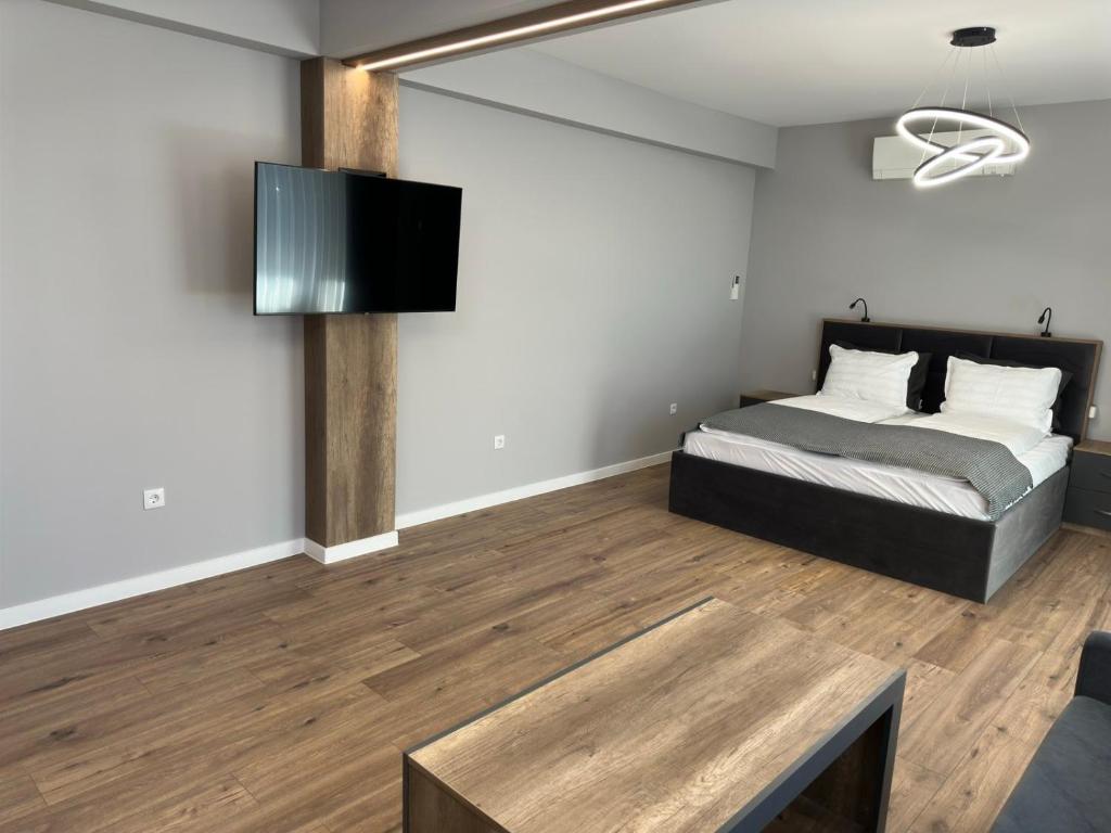 Postel nebo postele na pokoji v ubytování Vimar Apartments