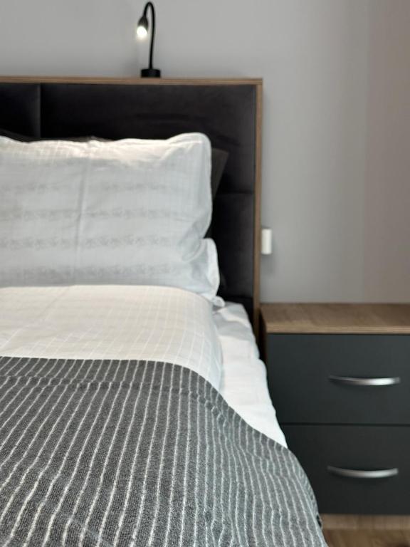 Postel nebo postele na pokoji v ubytování Vimar Apartments