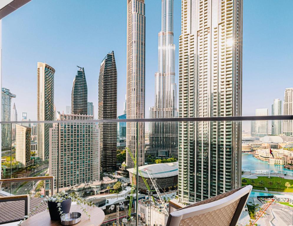 a view of a city skyline with tall buildings at Lux Escape, Burj Crown Opera View, Near Dubai Mall in Dubai