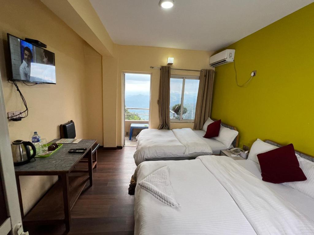 Postel nebo postele na pokoji v ubytování Hotel Village View Nagarkot