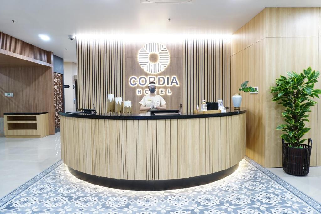a lobby of a hotel with a reception desk at Cordia Hotel Yogyakarta - Hotel Dalam Bandara in Glagah