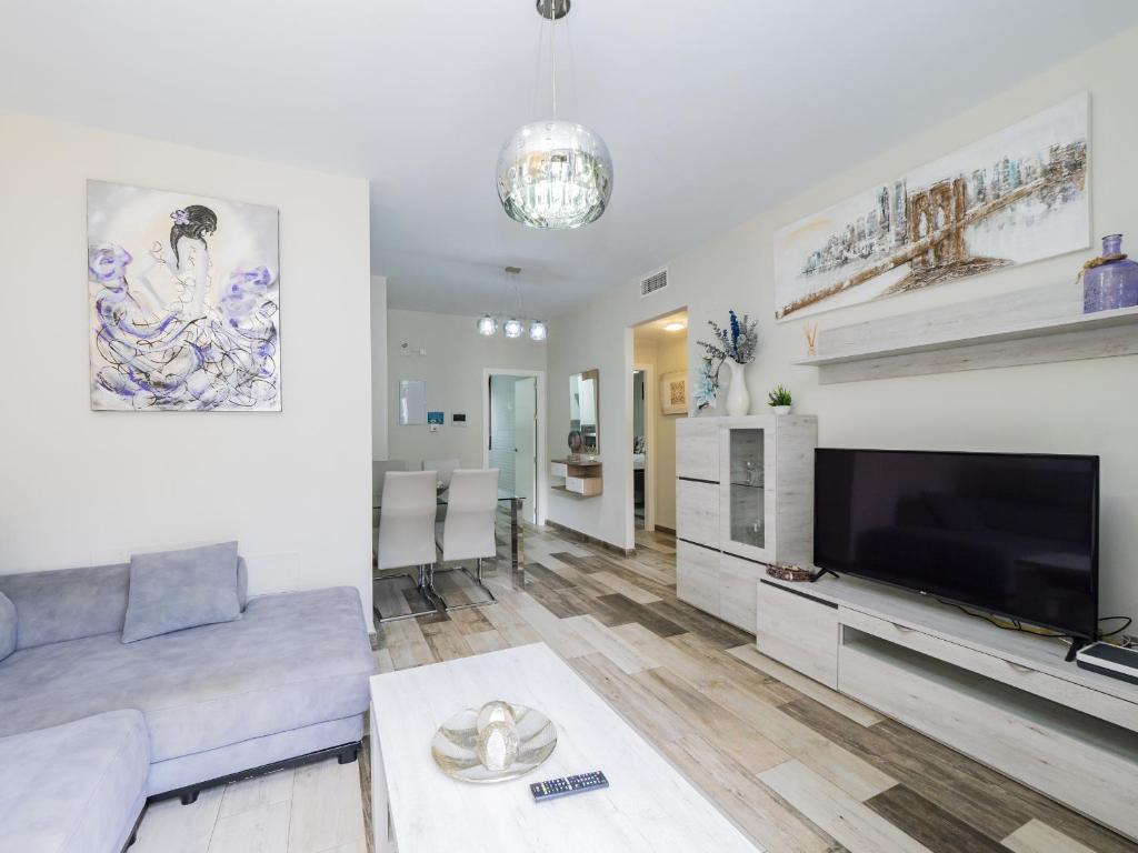 Televízia a/alebo spoločenská miestnosť v ubytovaní Cubo's Urban Suite Town Centre