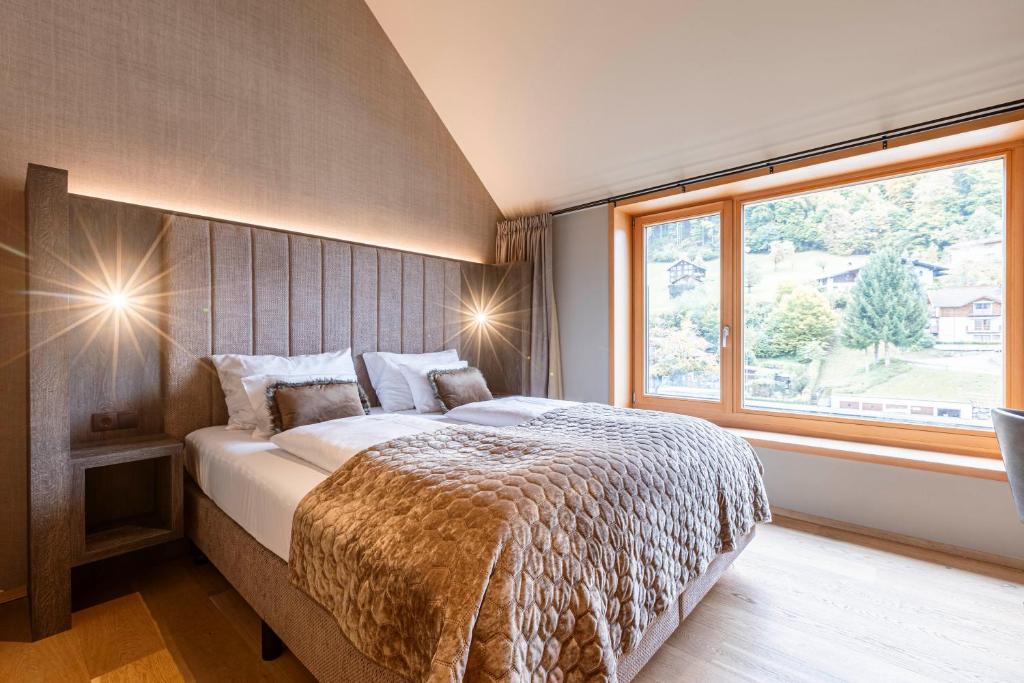 Postel nebo postele na pokoji v ubytování Montafon Suites Schruns by ALPS RESORTS
