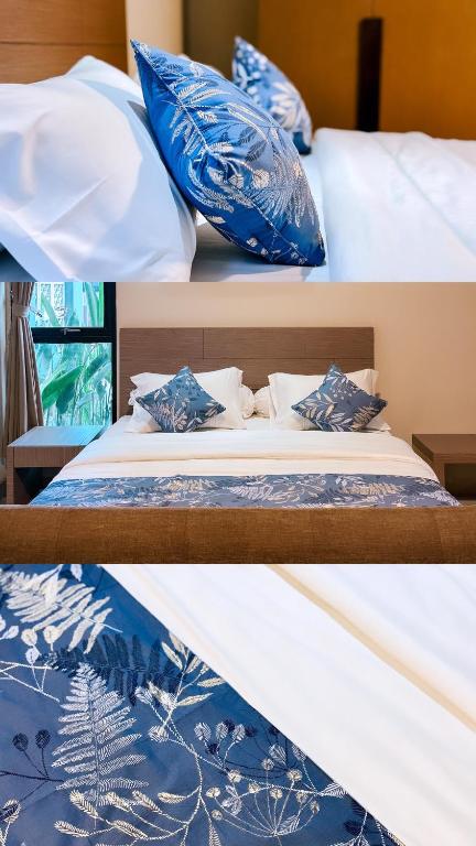 Ένα ή περισσότερα κρεβάτια σε δωμάτιο στο Nawasena Suites