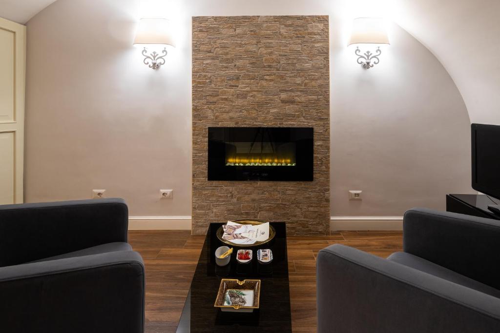 A television and/or entertainment centre at Le Piccole Lune di Monti