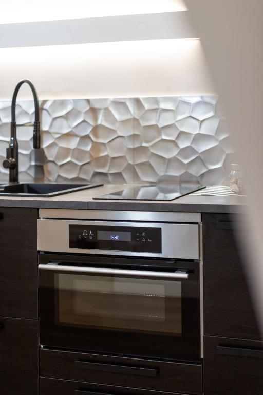A kitchen or kitchenette at Le Piccole Lune di Monti