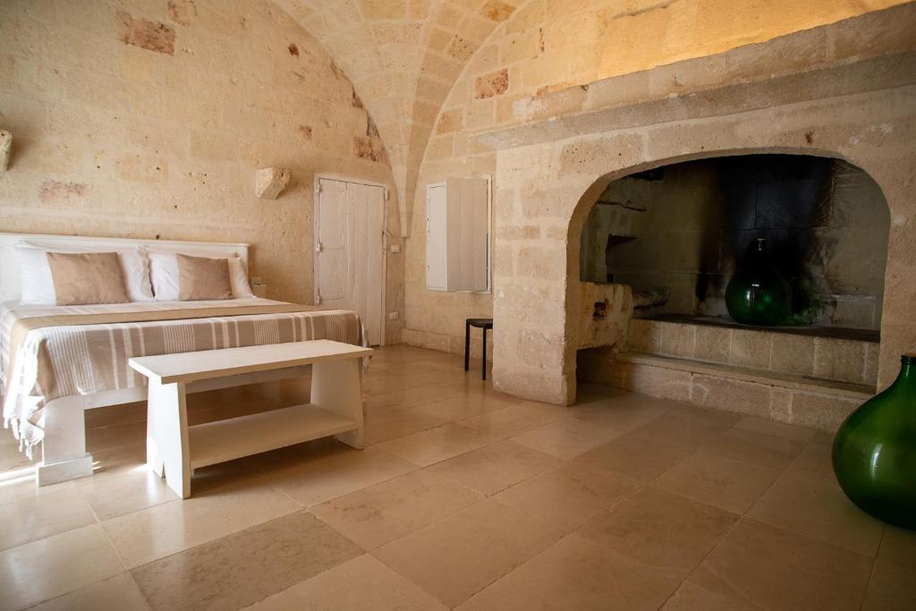 Posteľ alebo postele v izbe v ubytovaní MASSERIA SCALEDDA