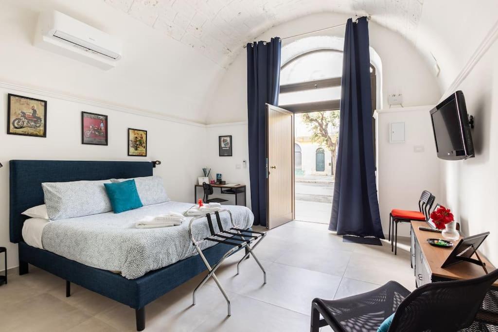 Postel nebo postele na pokoji v ubytování Casa dei Nonni Loft