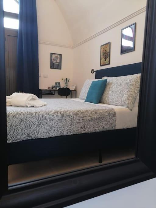 Postel nebo postele na pokoji v ubytování Casa dei Nonni Loft