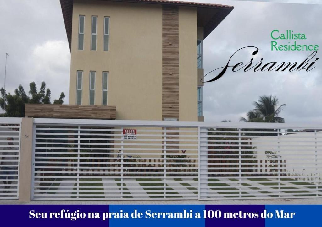 a metal fence in front of a building at Callista Residence Flat in Porto De Galinhas
