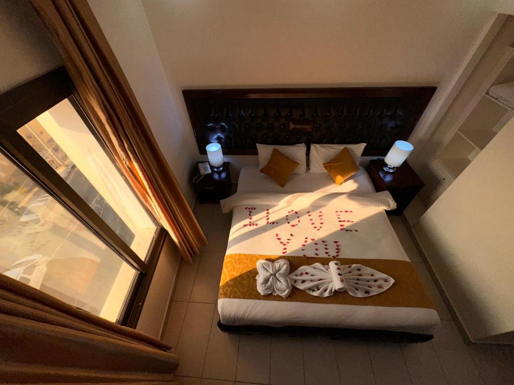 Postel nebo postele na pokoji v ubytování Sharah Mountains Hotel